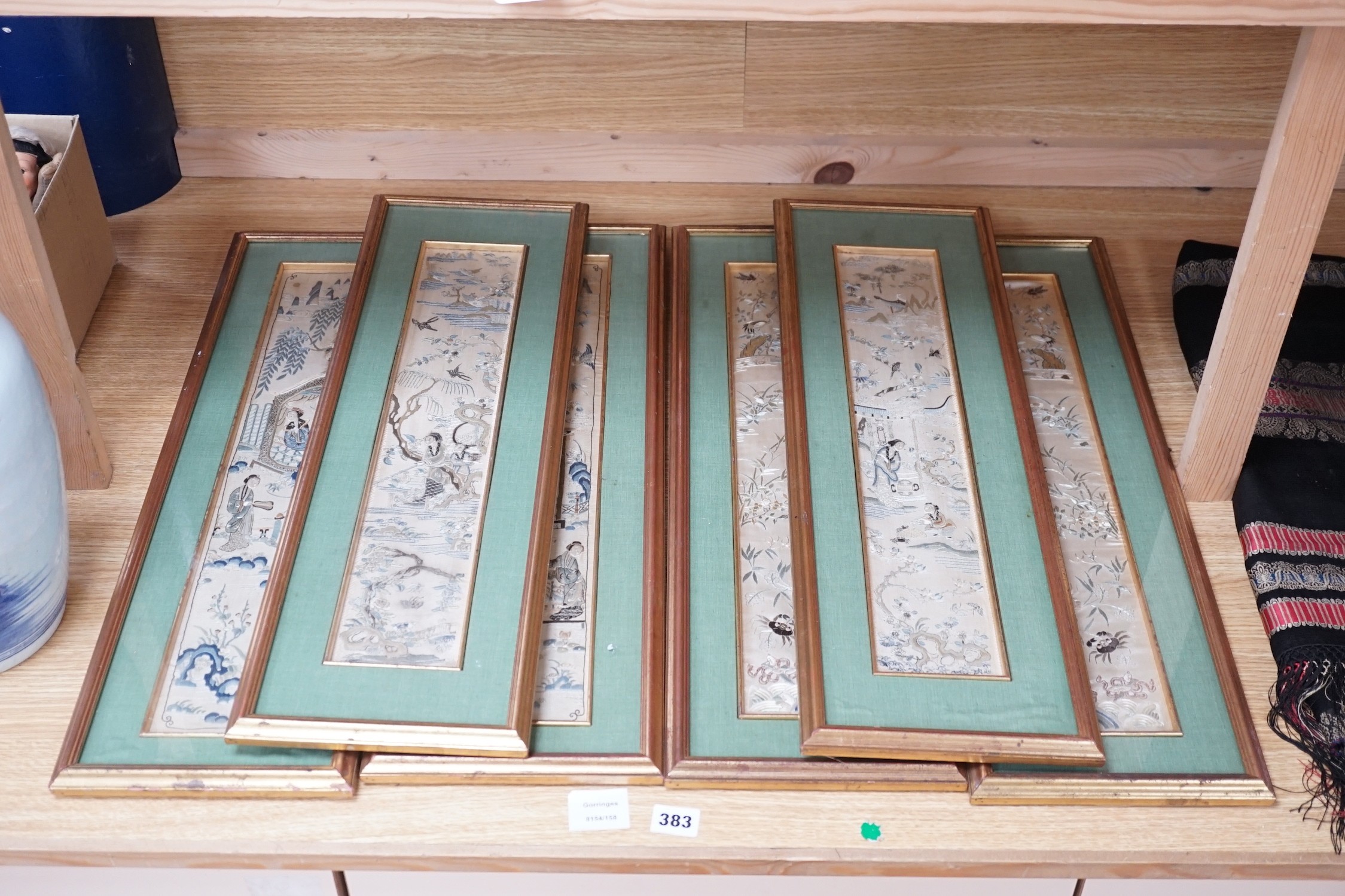 Three pairs of gilt framed, 19th century, silk embroidered, sleeve bands (for Chinese robes), 49cms long x 9cms wide (not including mount or frame)